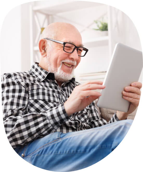 older gentleman interacting with a tablet